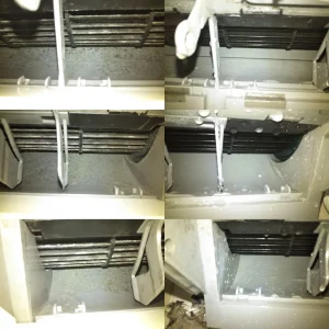 エアコン内部のアルミフィンに付いた黒カビ汚れを、洗浄液で丁寧に洗い流している様子です。
